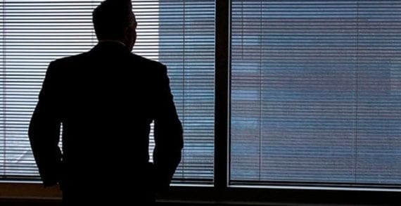 Businessman staring out of window Five reasons why businesses and leaders fail