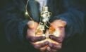 Man holding lightbulb Energy sector key to reviving post-pandemic Canadian economy