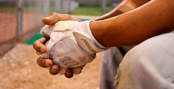 Baseball player sittnig on the bench Baseball all-star shift puts spotlight on Colorado’s exceptional voting laws