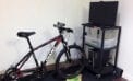 MedBIKE system stationary bike linked with tablet and video game Fitness program encourages kids with heart disease to train safely at home